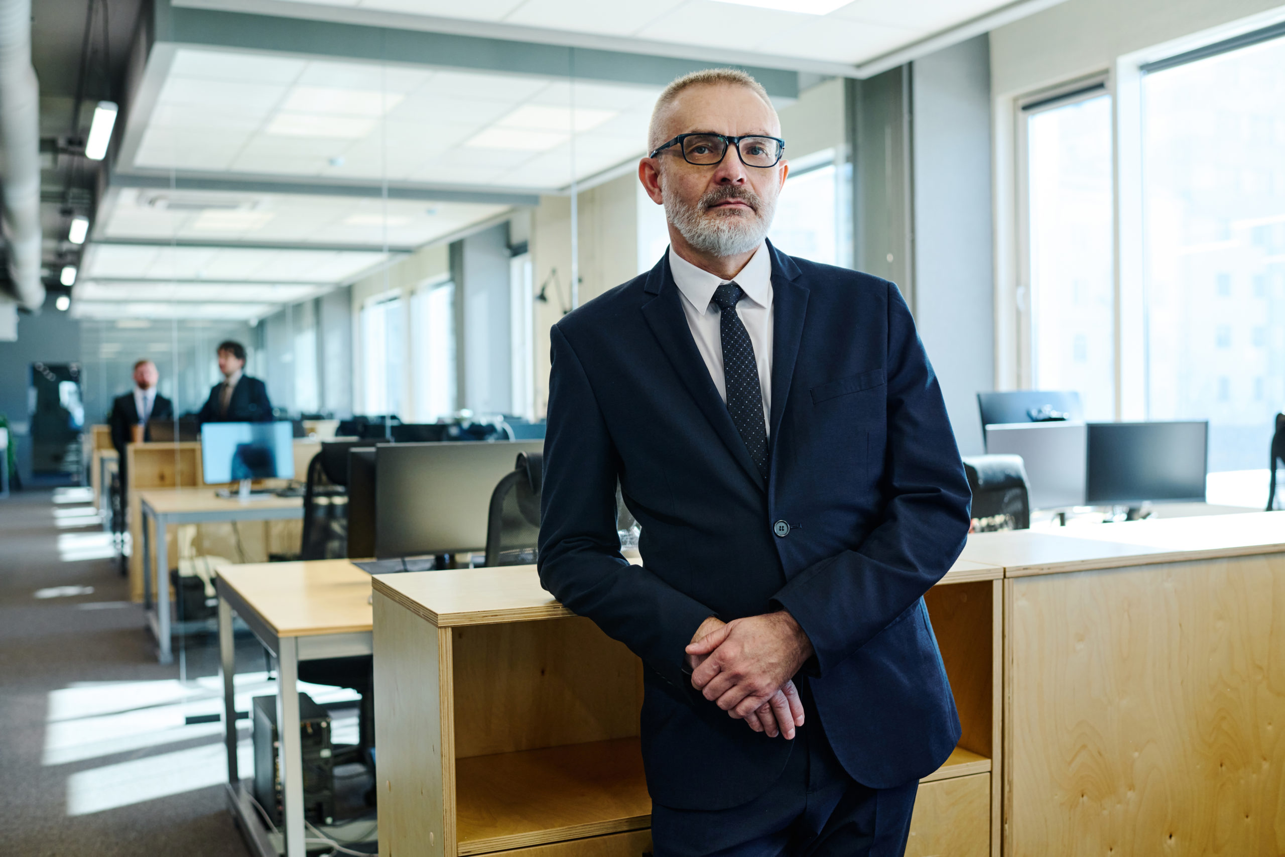 Mature Businessman In Suit At Office - Thargo Contabilidade